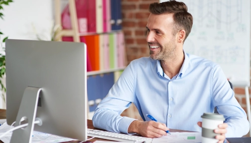 Happy man at desk